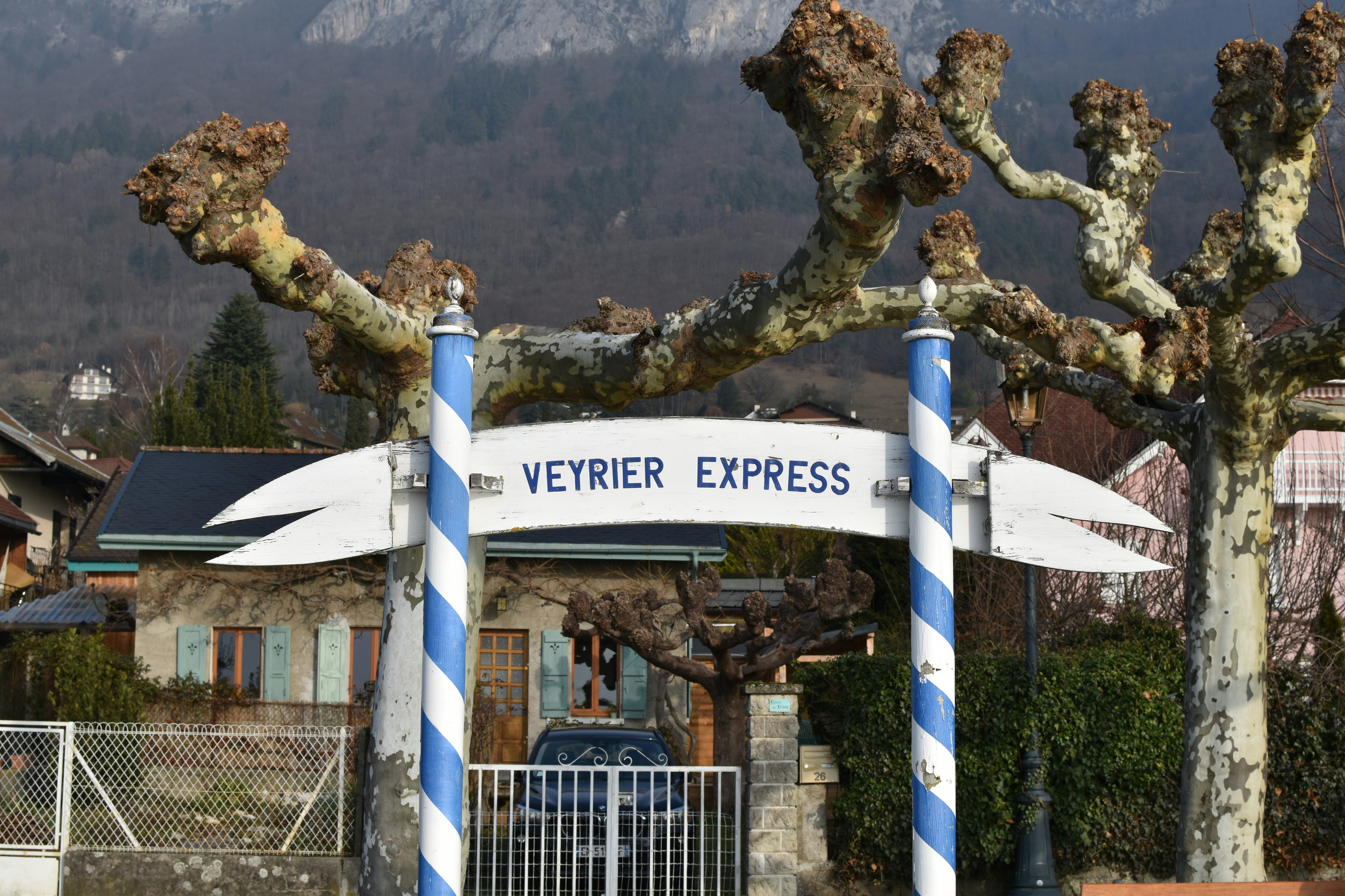 white and blue wooden signage